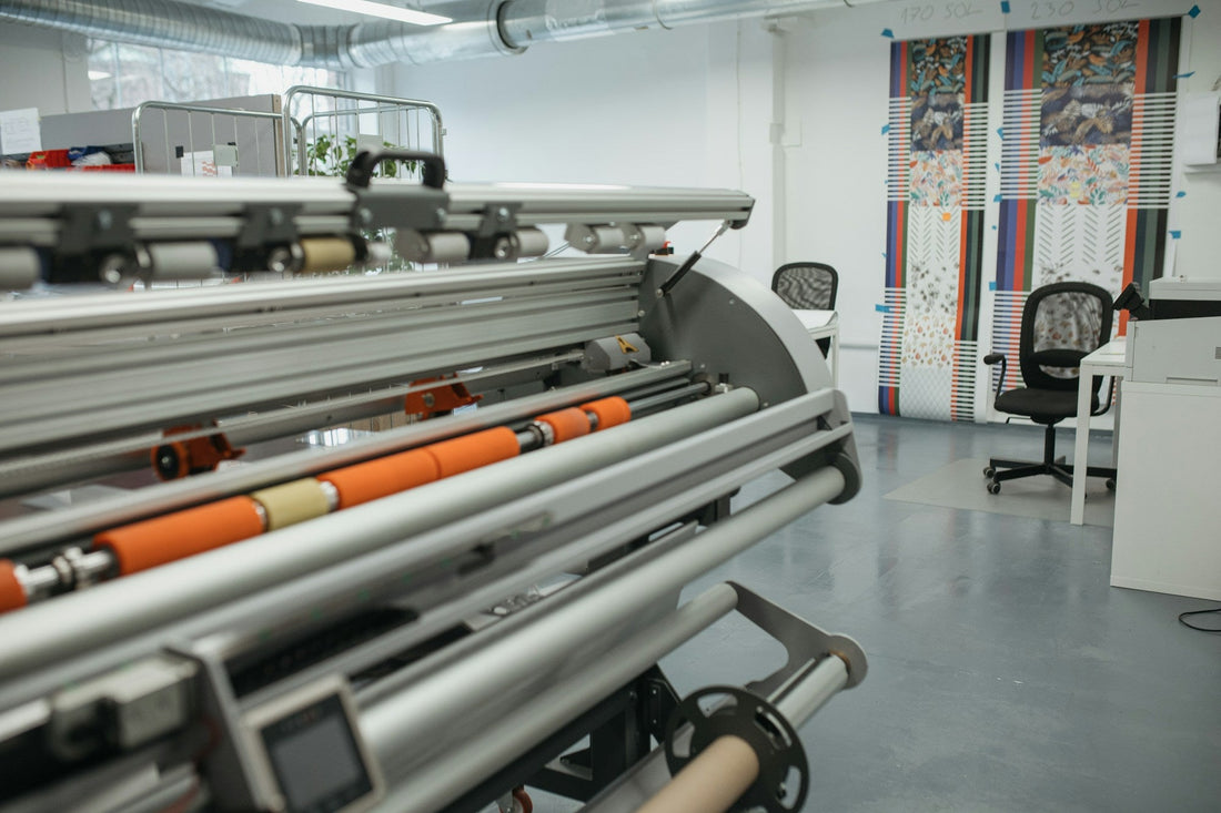 Roll-to-roll textile printing machine in a fabric printing workshop