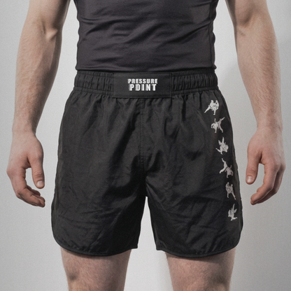 Kuzushi Fight Shorts, front view on model with the throw sequence down the leg
