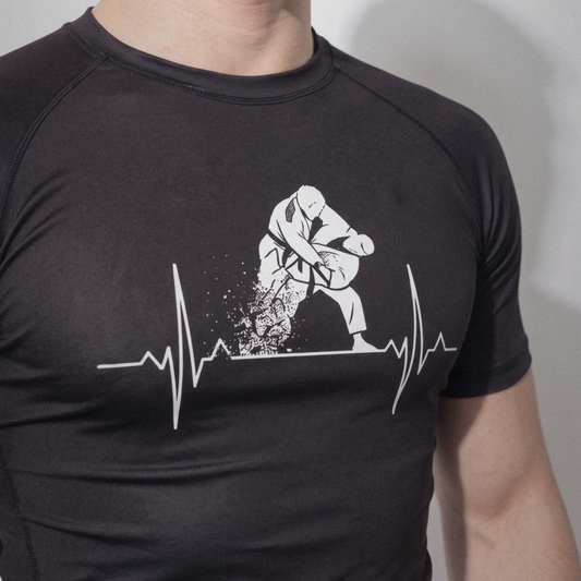 Kuzushi Pulse Rashguard, heartbeat-to-throw graphic on the chest